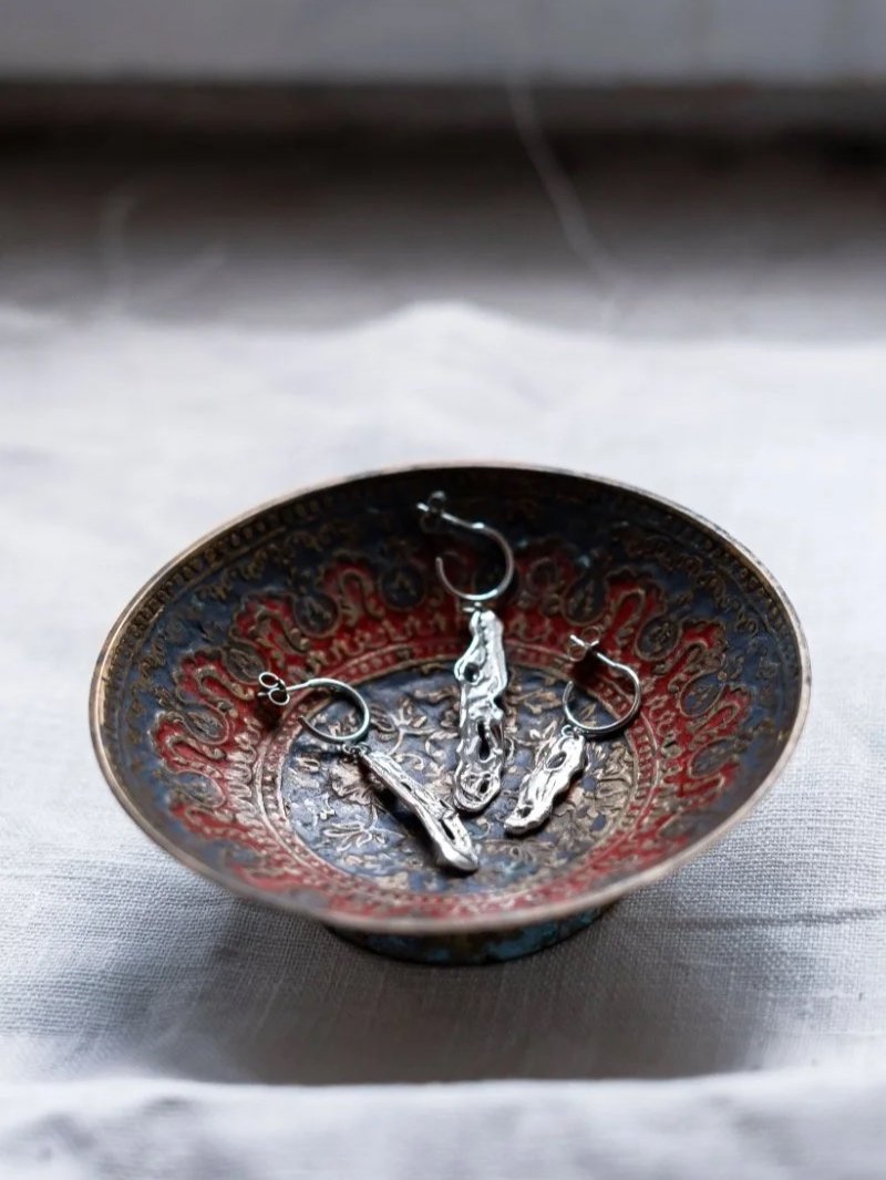 earrings are made from recycled sterling silver and shaped into an organic, fluid form that reflects the beauty of molten metal.