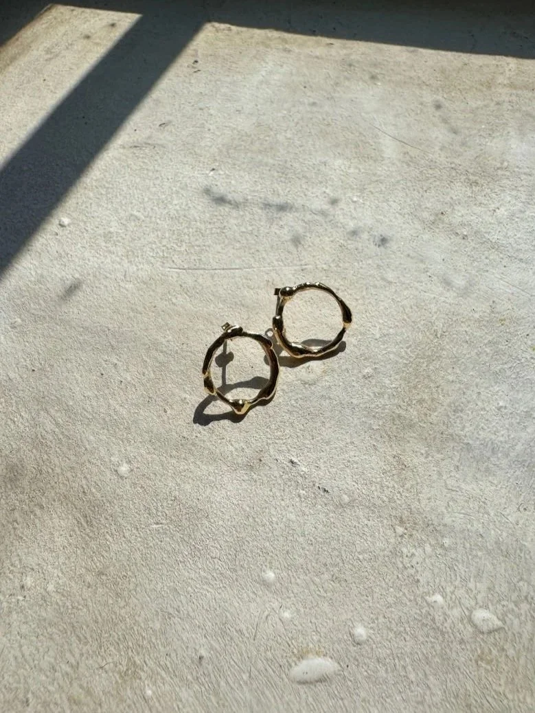 Modern reverse hoop earrings made in recycled 14 carat gold