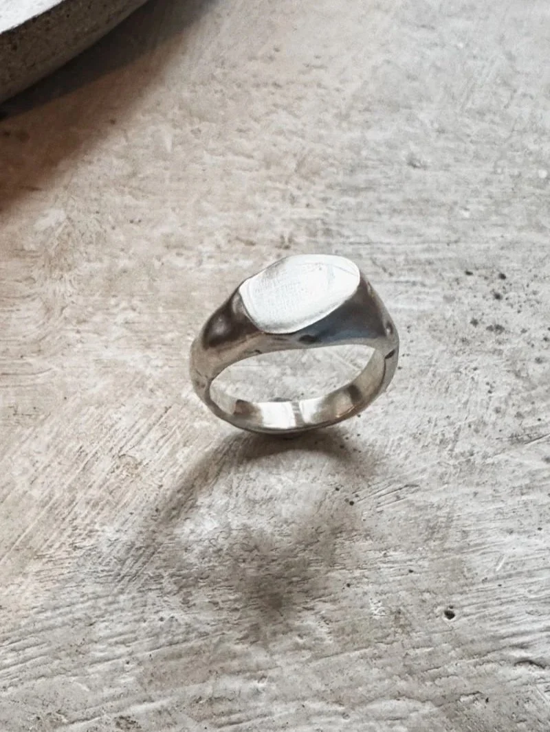 Handmade men’s signet ring in sterling silver with organic wabi sabi sides, matte finish and bold statement design