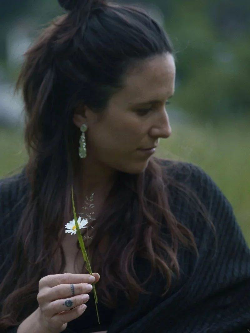 Artisan recycled sterling silver earrings with a raw moon-like texture and strong silver shine.