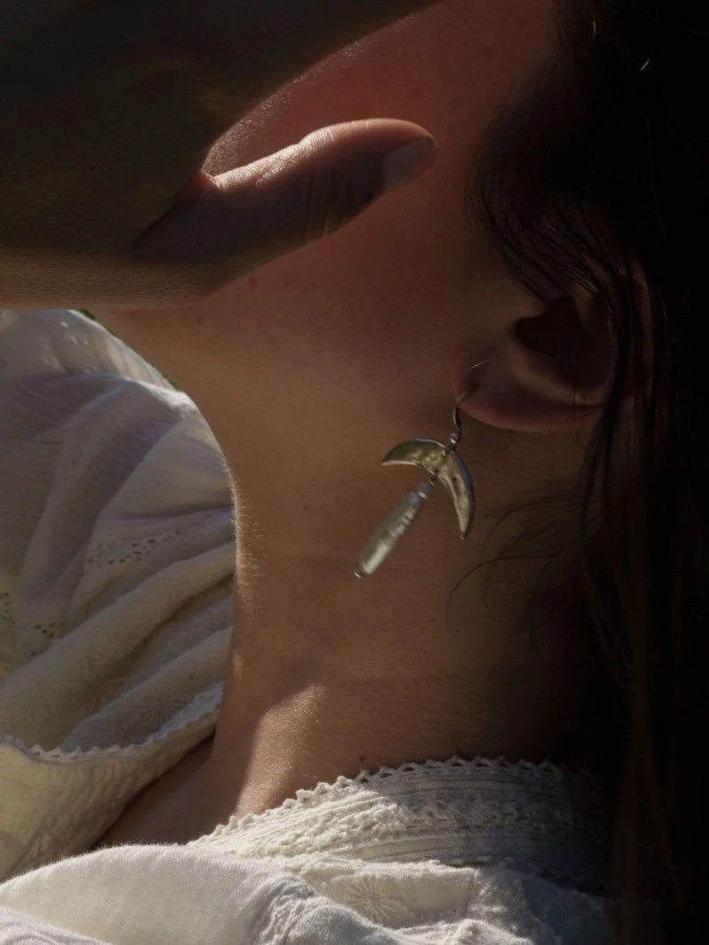 Handmade silver moon earrings with real keshi pearl, organic sculptural design and poetic celestial style.