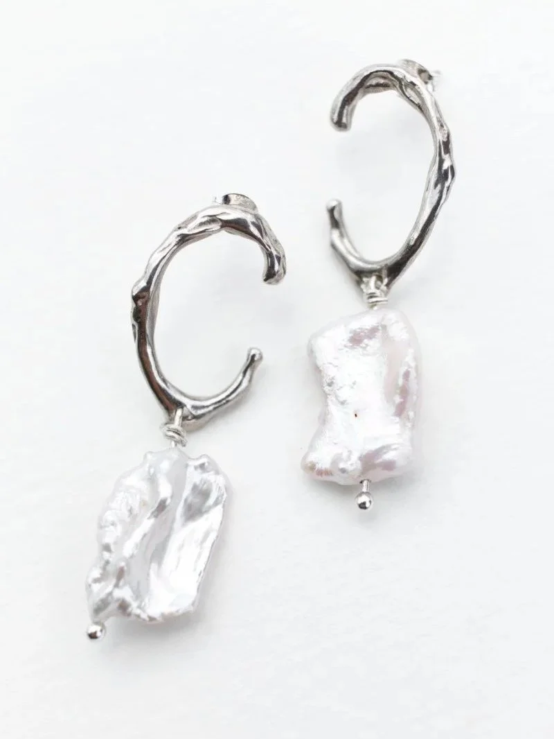 Handmade recycled sterling silver earrings with real freshwater cultured keshi pearls, organic sculptural design.