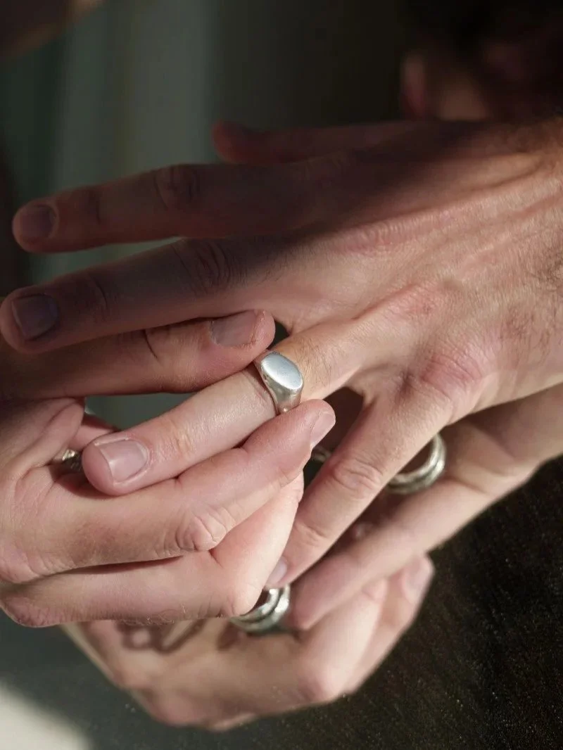 Bold silver signet ring for men with flat irregular top, handcrafted wabi sabi texture and modern artisanal style