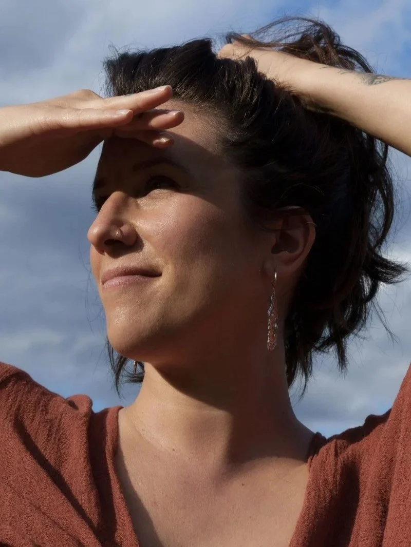 Minimal yet statement recycled silver earrings with fluid texture and luminous polished glow.
