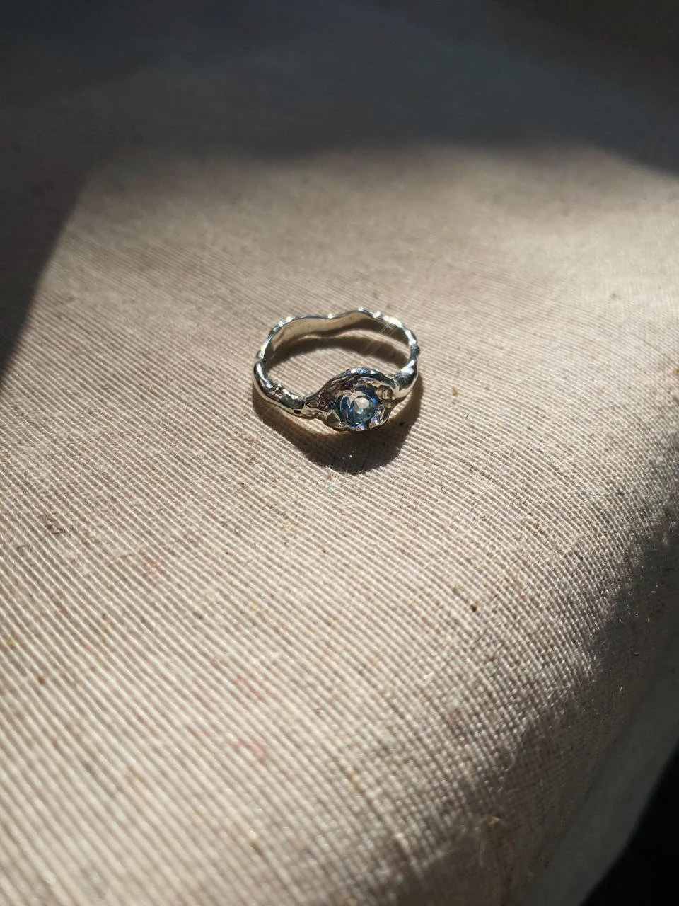 Organic topaz gemstone ring with a raw artisan finish, handmade in recycled precious metals for lovers of modern conscious jewellery.