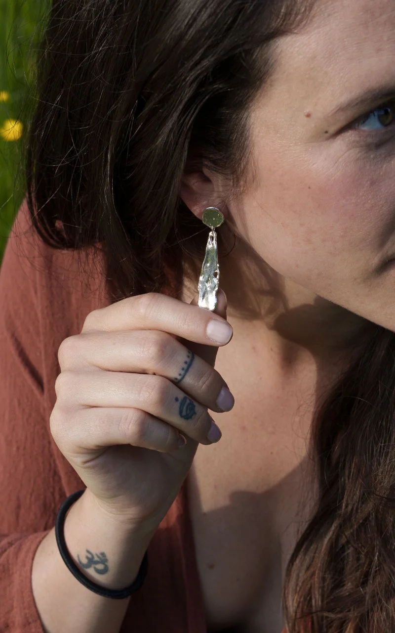 Lunar earrings in recycled sterling silver with a sculptural moon-like surface and high shine.