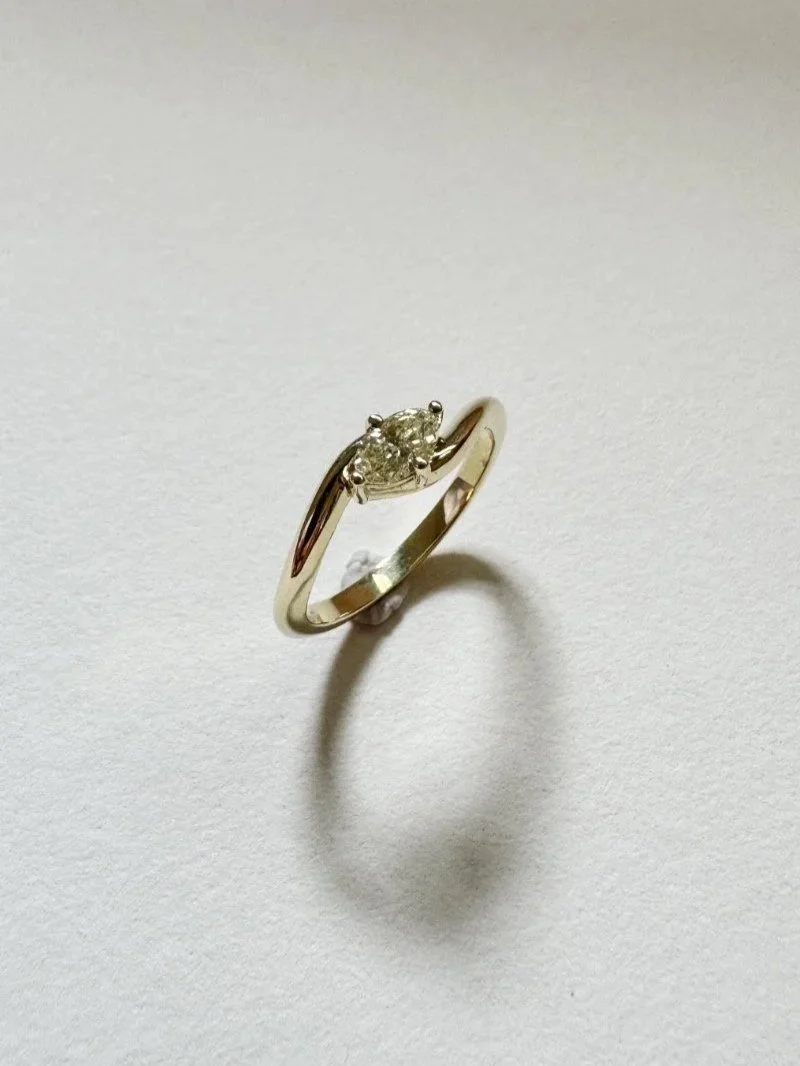 Handmade green sapphire engagement ring in gold with timeless classic design and elegant detail