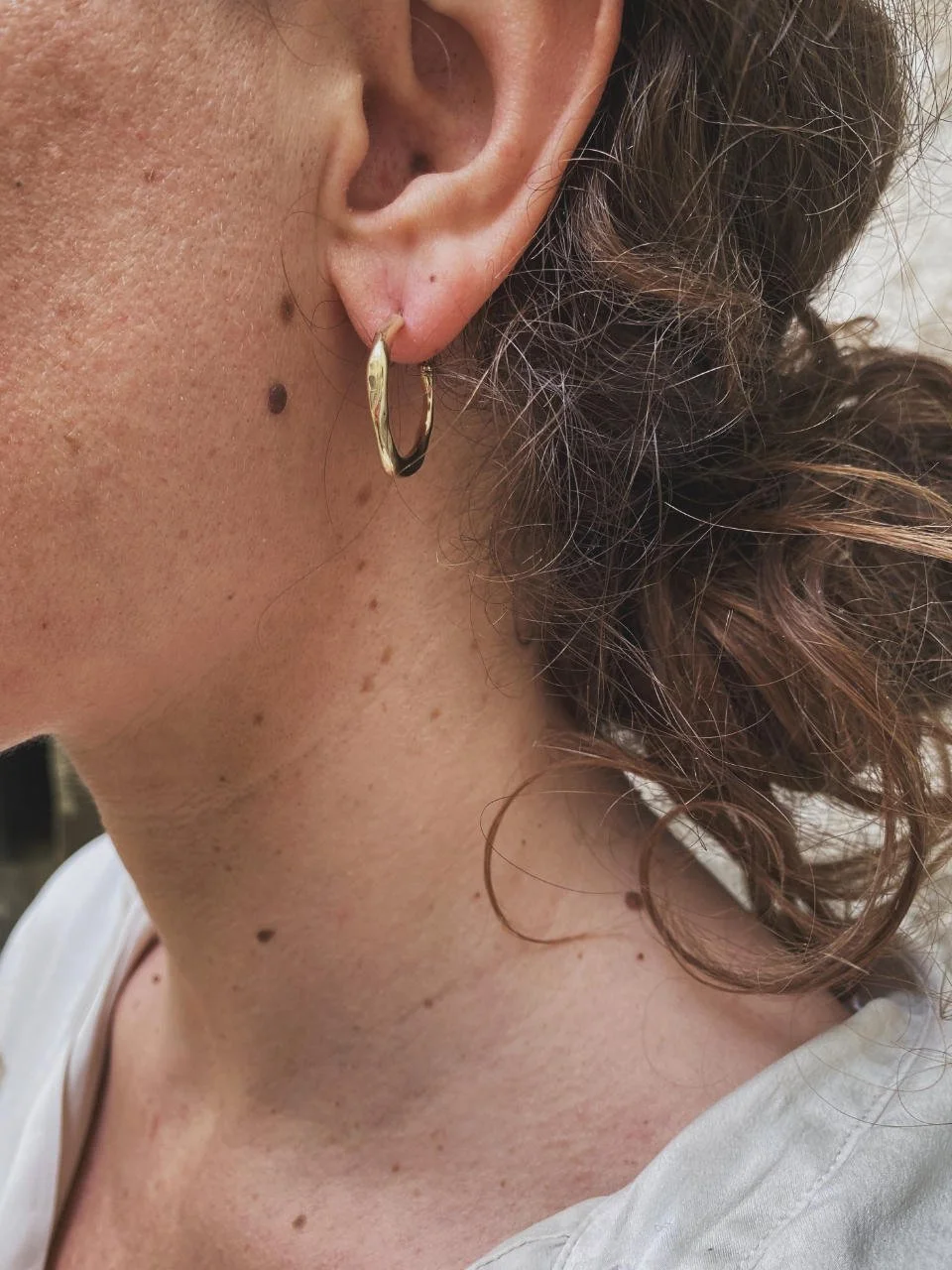 Organic midi earrings handcrafted in recycled sterling silver or 14ct and 18ct gold with a raw wabi-sabi aesthetic.