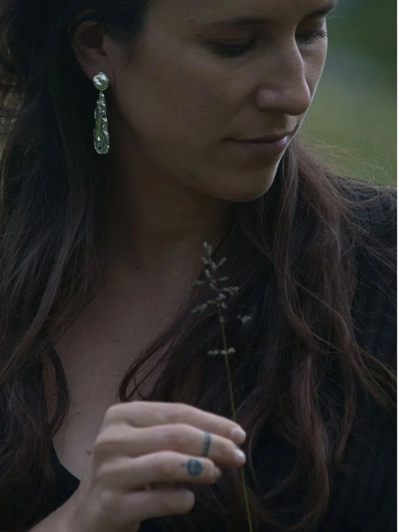 Sustainable handmade silver earrings inspired by the lunar surface, bold, organic and luminous.