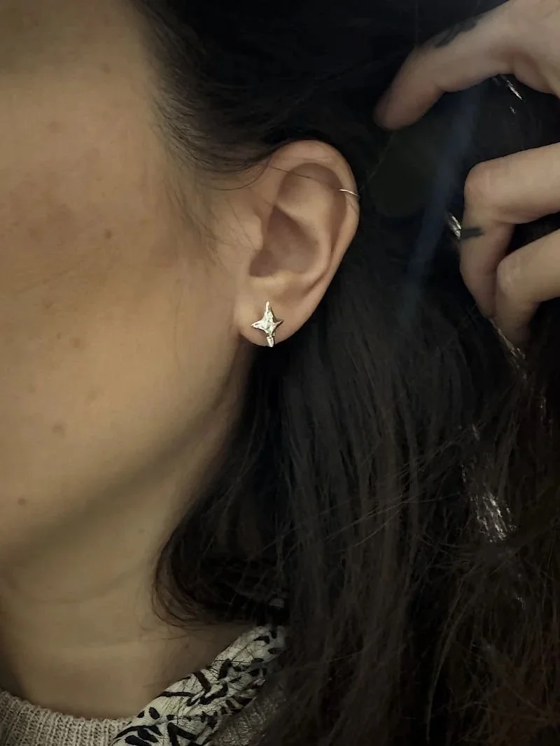 Minimal moon and star stud earrings in recycled sterling silver, a unique handmade jewellery gift for dreamers and stargazers.