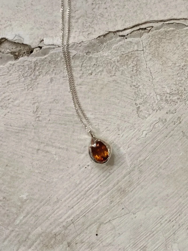 Modern necklace with a citrine gemstone.