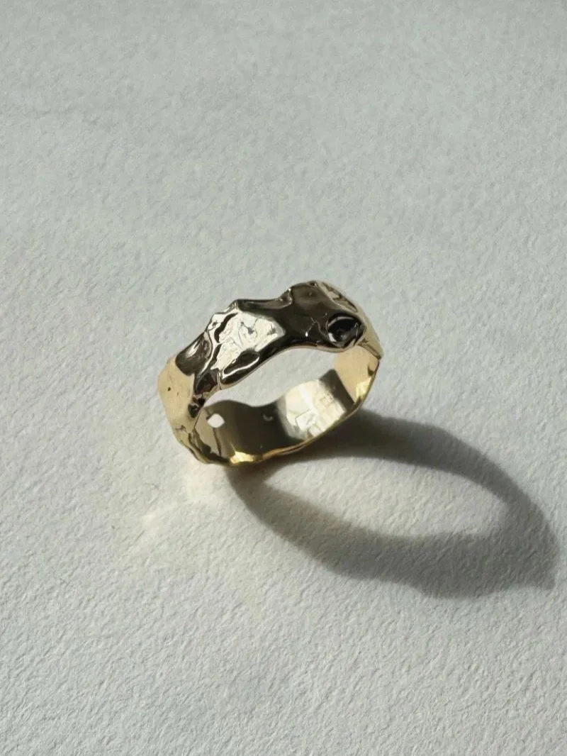 Modern and bold gold stacking ring with natural imperfections