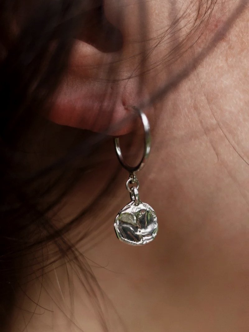 Modern handmade jewellery earrings with round organic texture pendant for expressive women who love raw design