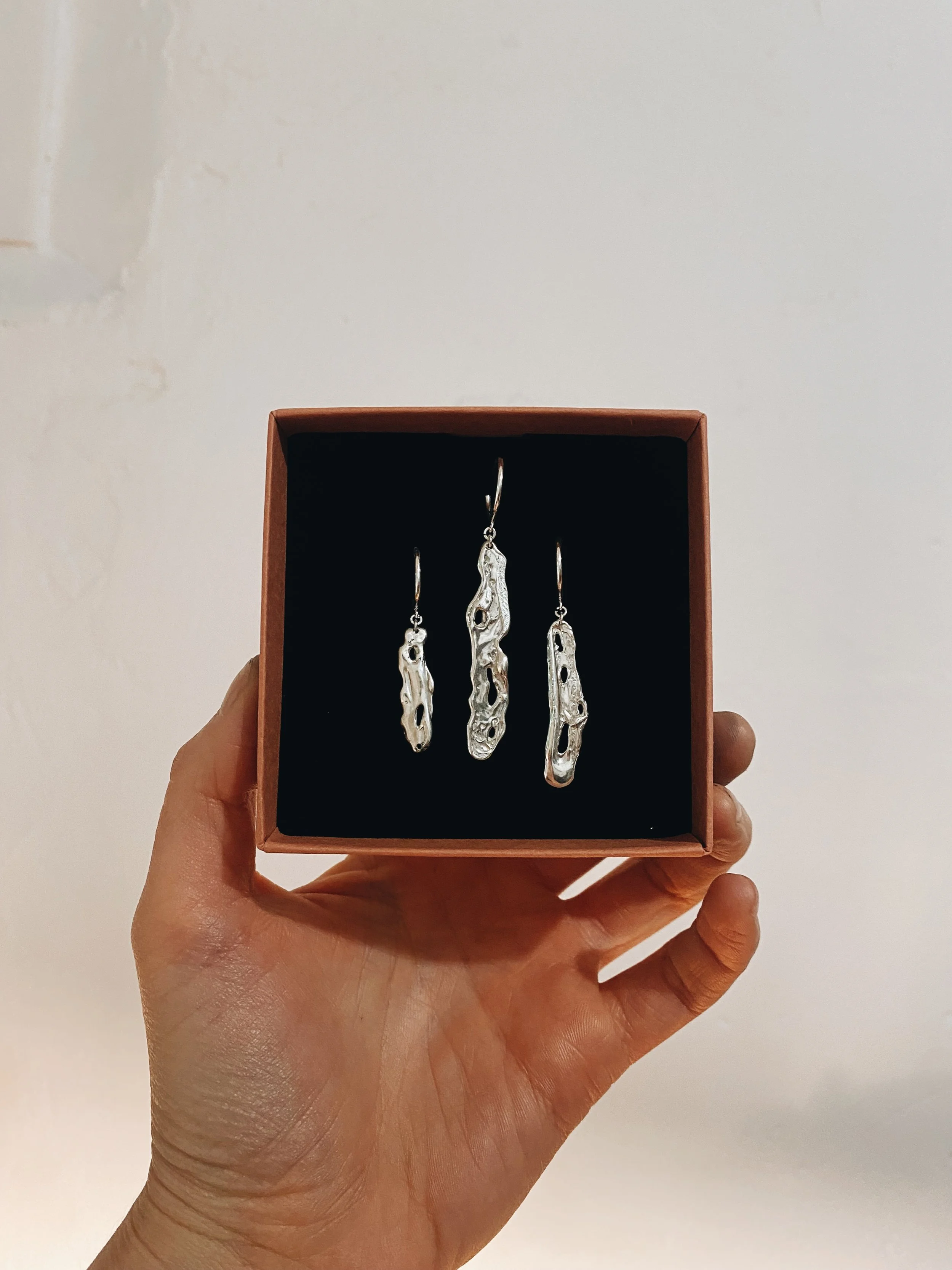 Juno earrings in three different sizes.
