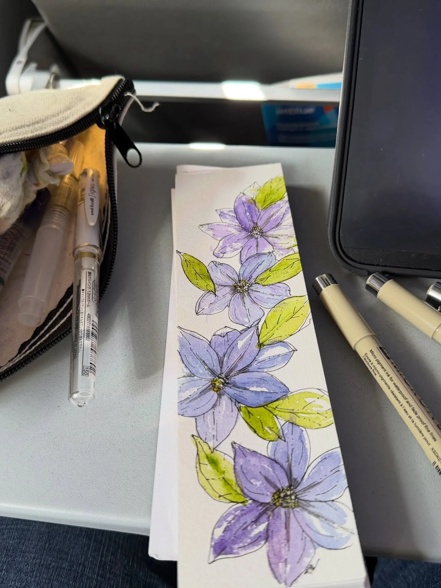 Traveling again so I&rsquo;m back to #planeair art 😆. With unpredictable turbulence,  I like working on #watercolorandink to embrace the natural flows. 

#watercolorbookmarks #watercolorflorals #arthealstheheart
