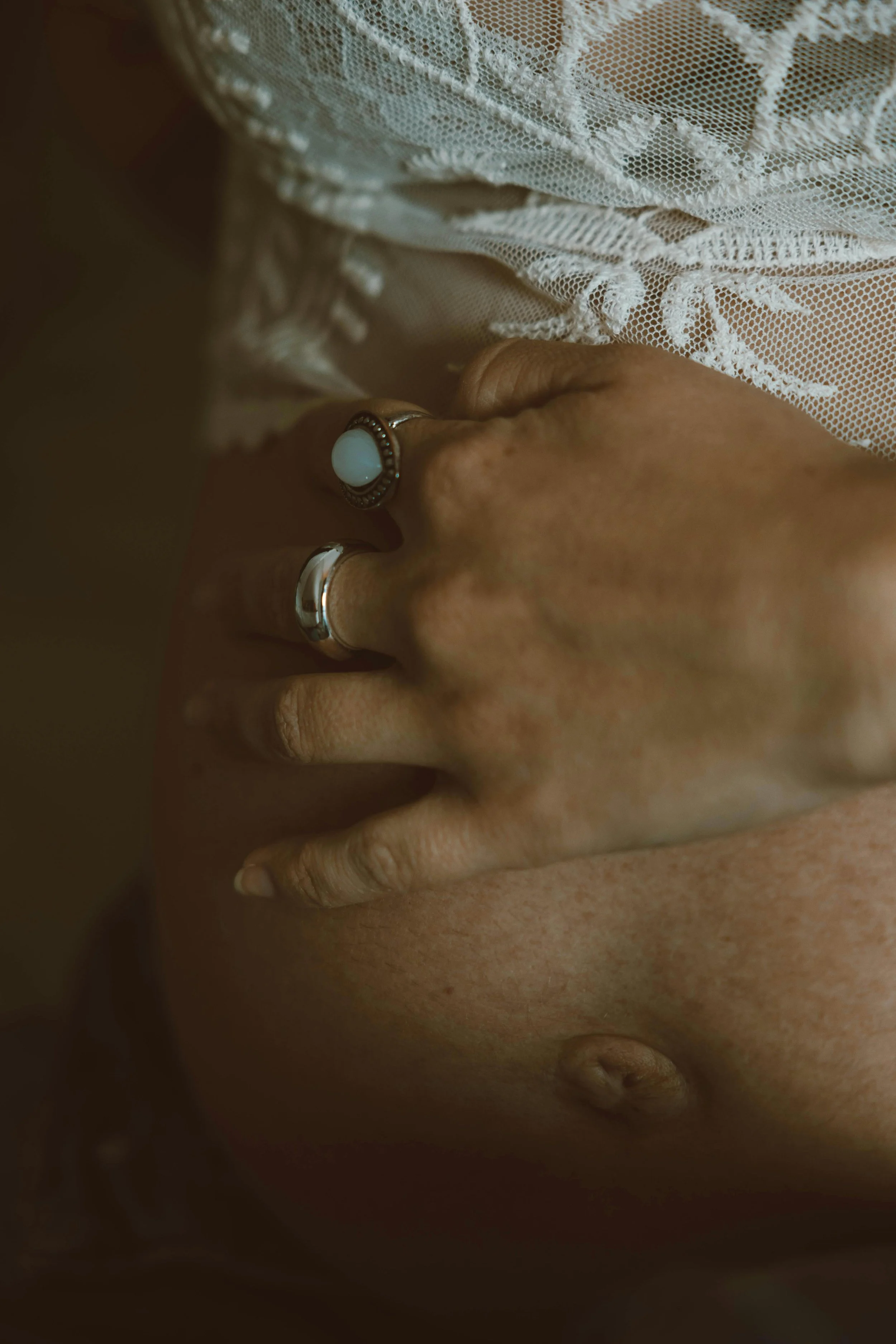 Pregnant mother with hand on belly, feeling prepared for birth and postpartum after a prenatal visit with Kelsi, Southern Oregon doula.