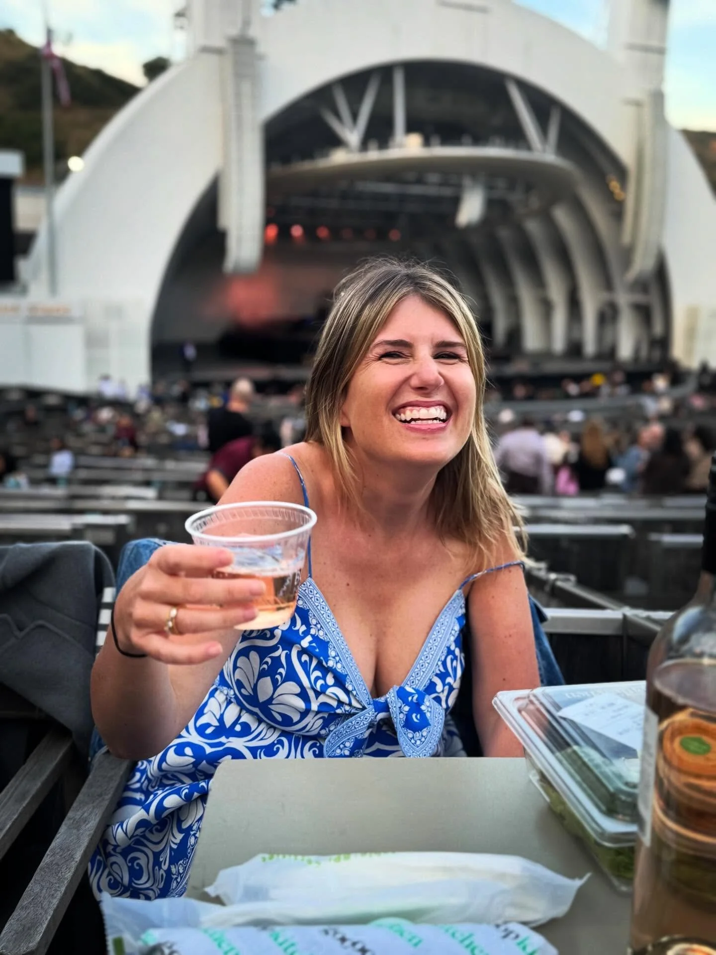 The face and pinky of a woman who has forgotten she has a 7 am flight back to Manhattan.