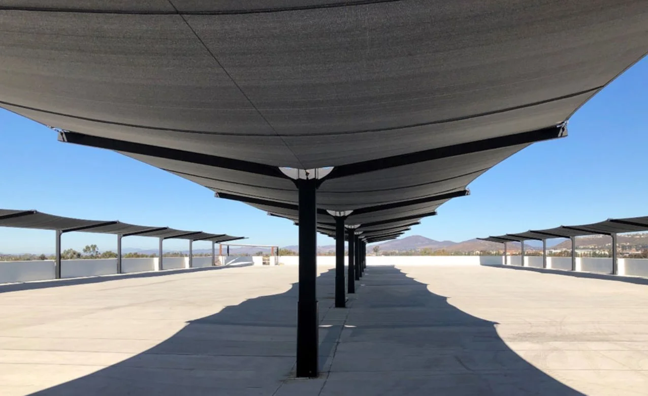 Empty rooftop with a large overhead shade structure. Commercial shade sails. commercial shade awning, shade canopy, shade canopies, shade umbrella.