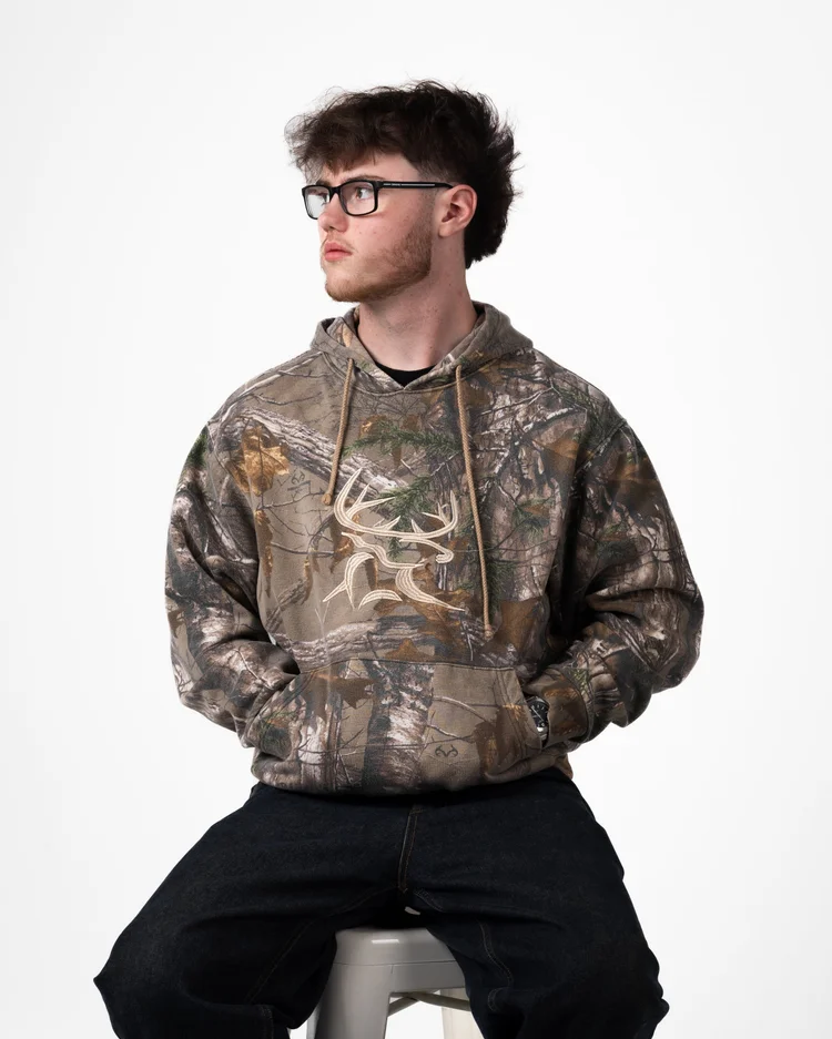 Cam Dunstan seated for a portrait at 921 Studios