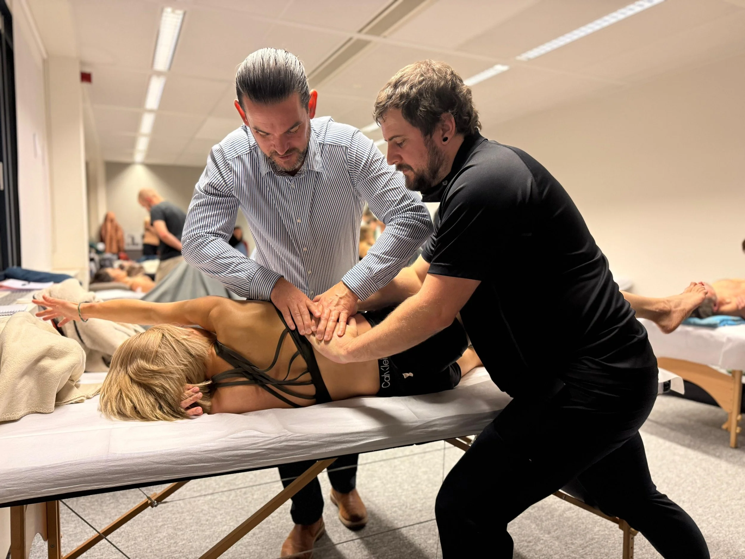 image of Parker Loesch working with his teacher doing Structural Integration