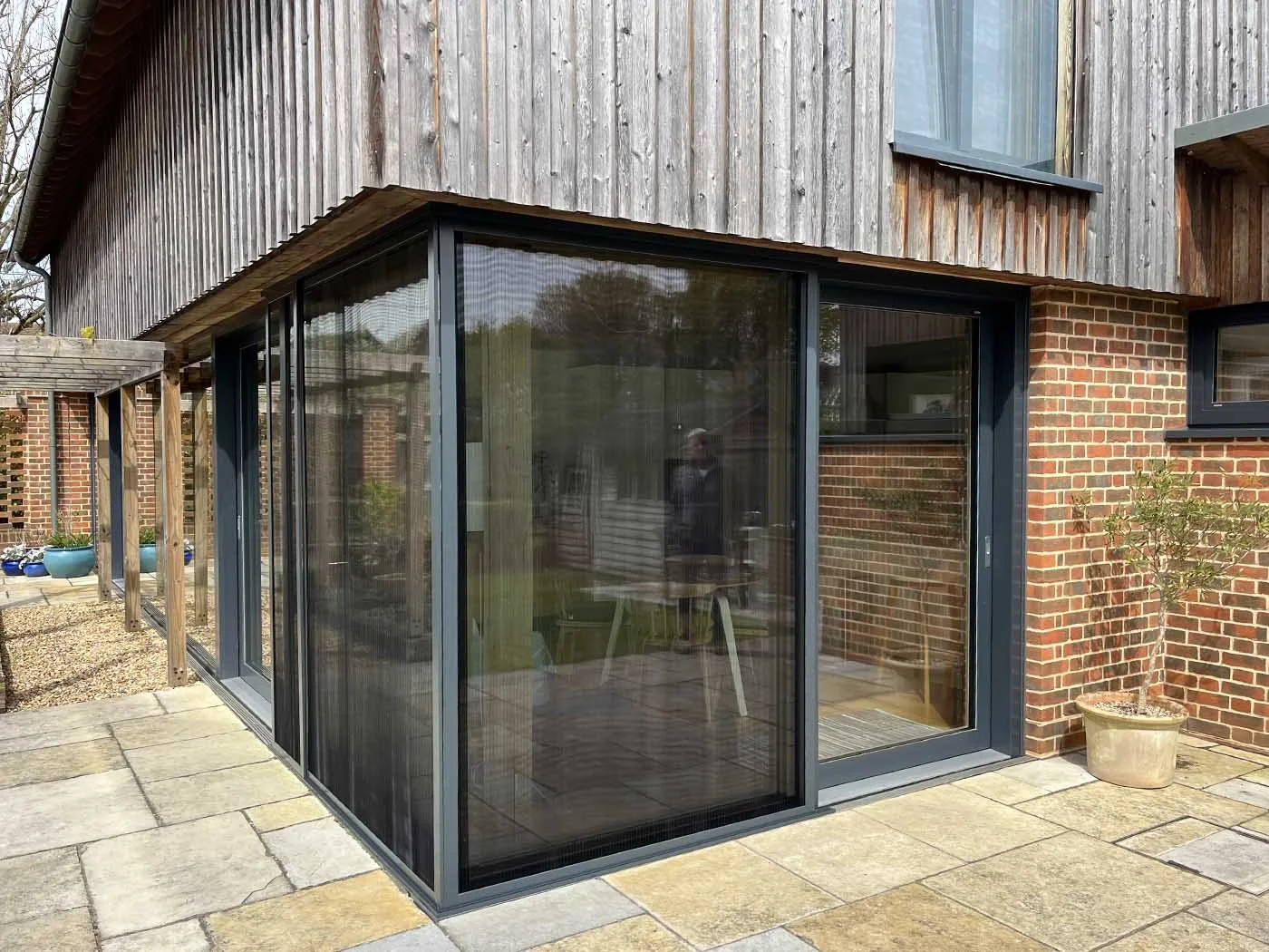 Side view of MicroLouvre screens installed on a modern home