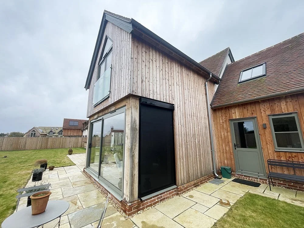 External roller screens fitted to a contemporary new build home