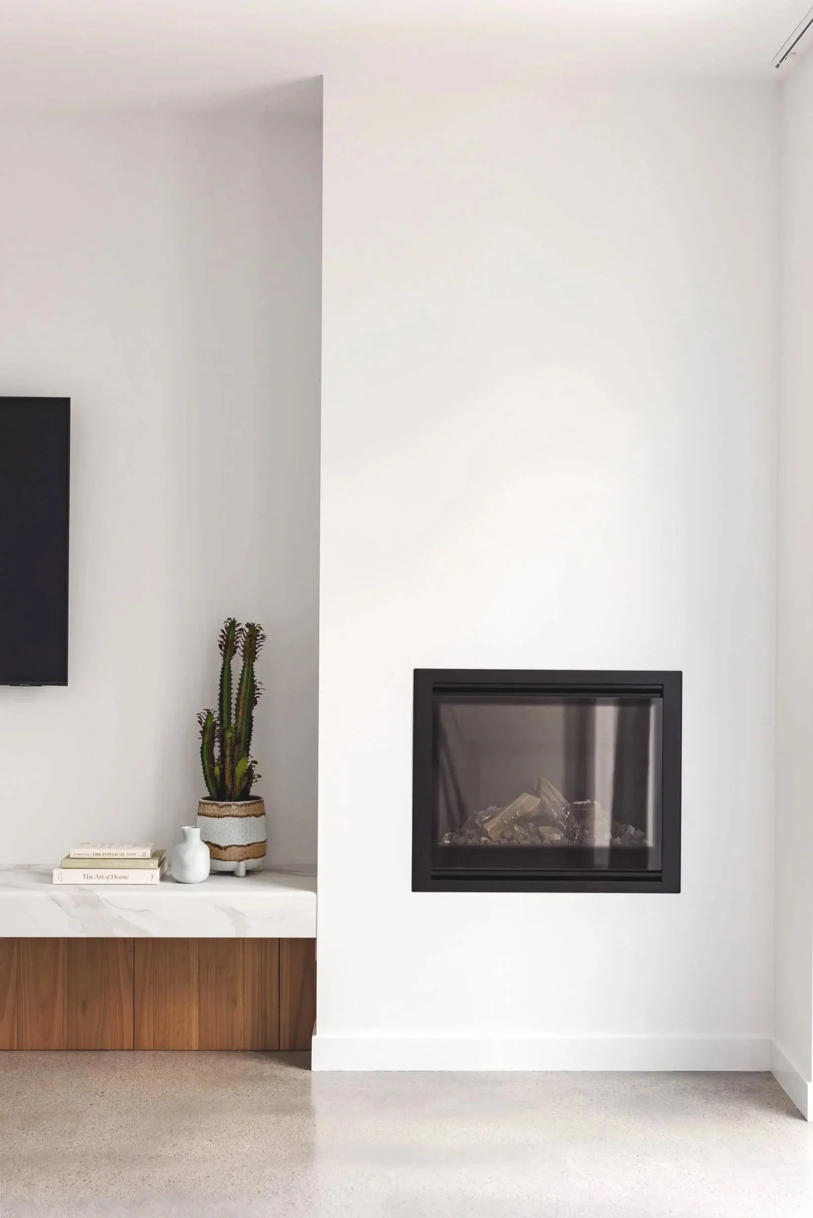 Custom fireplace and limestone heated concrete floors at Pacific 5. Premium architectural photography and film documenting true materiality and craftsmanship for Master Builders and designers in Regional NSW.