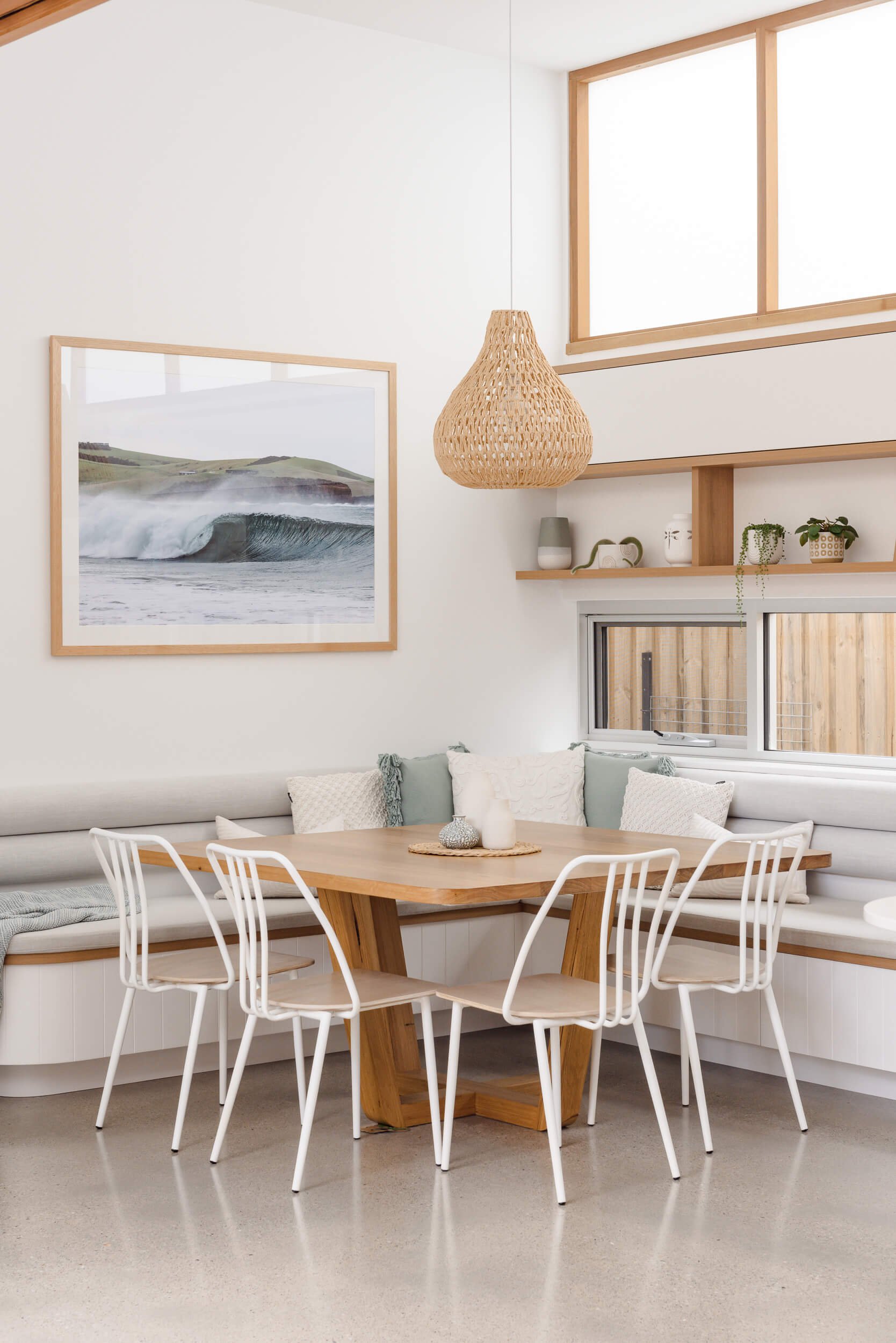 Built-in timber dining nook and coastal interior styling at Pacific 5. Premium architectural photography and film documenting true materiality and craftsmanship for Master Builders, architects and designers in Regional NSW.