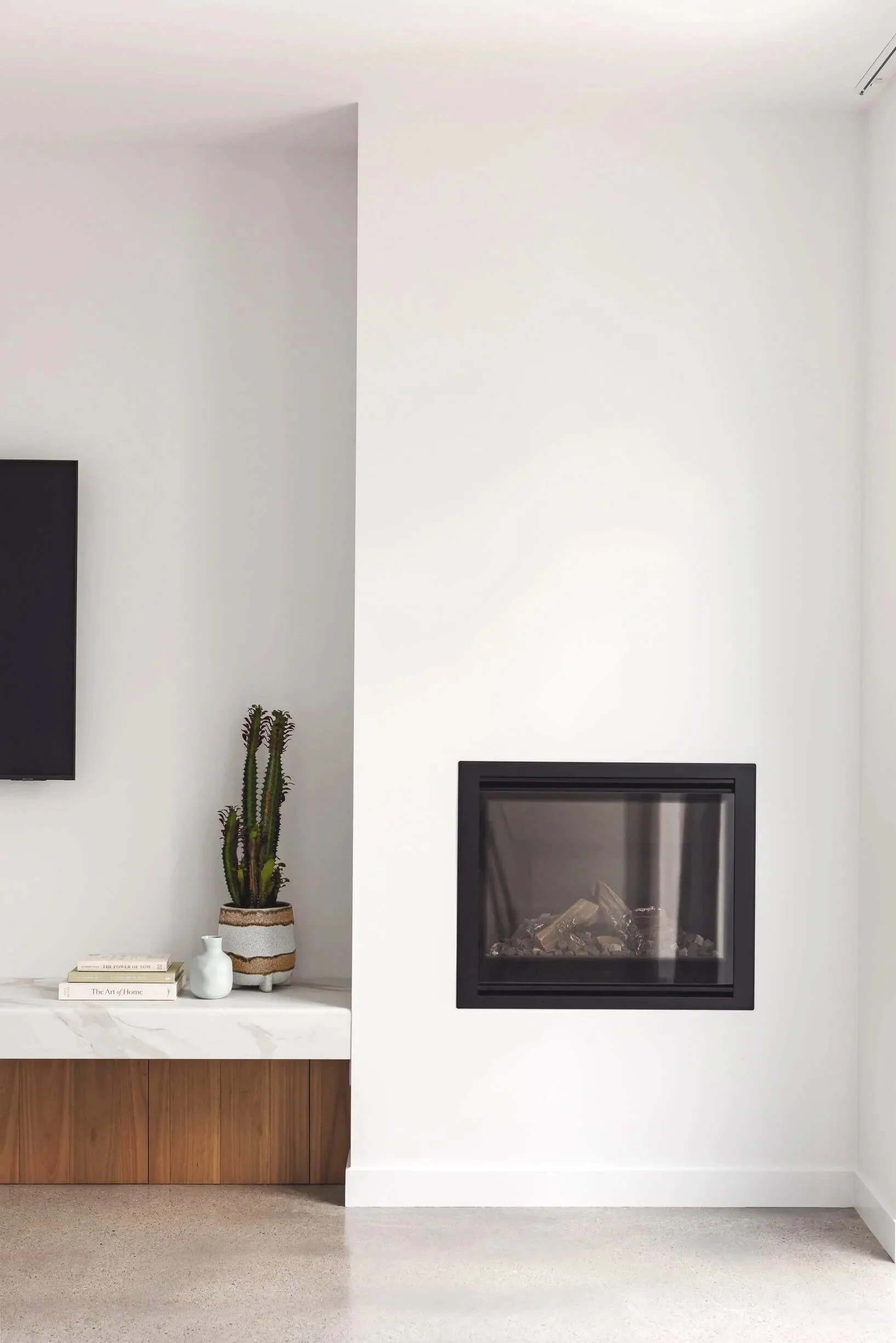 Custom fireplace and limestone heated concrete floors at Pacific 5. Premium architectural photography and film documenting true materiality and craftsmanship for Master Builders and designers in Regional NSW.