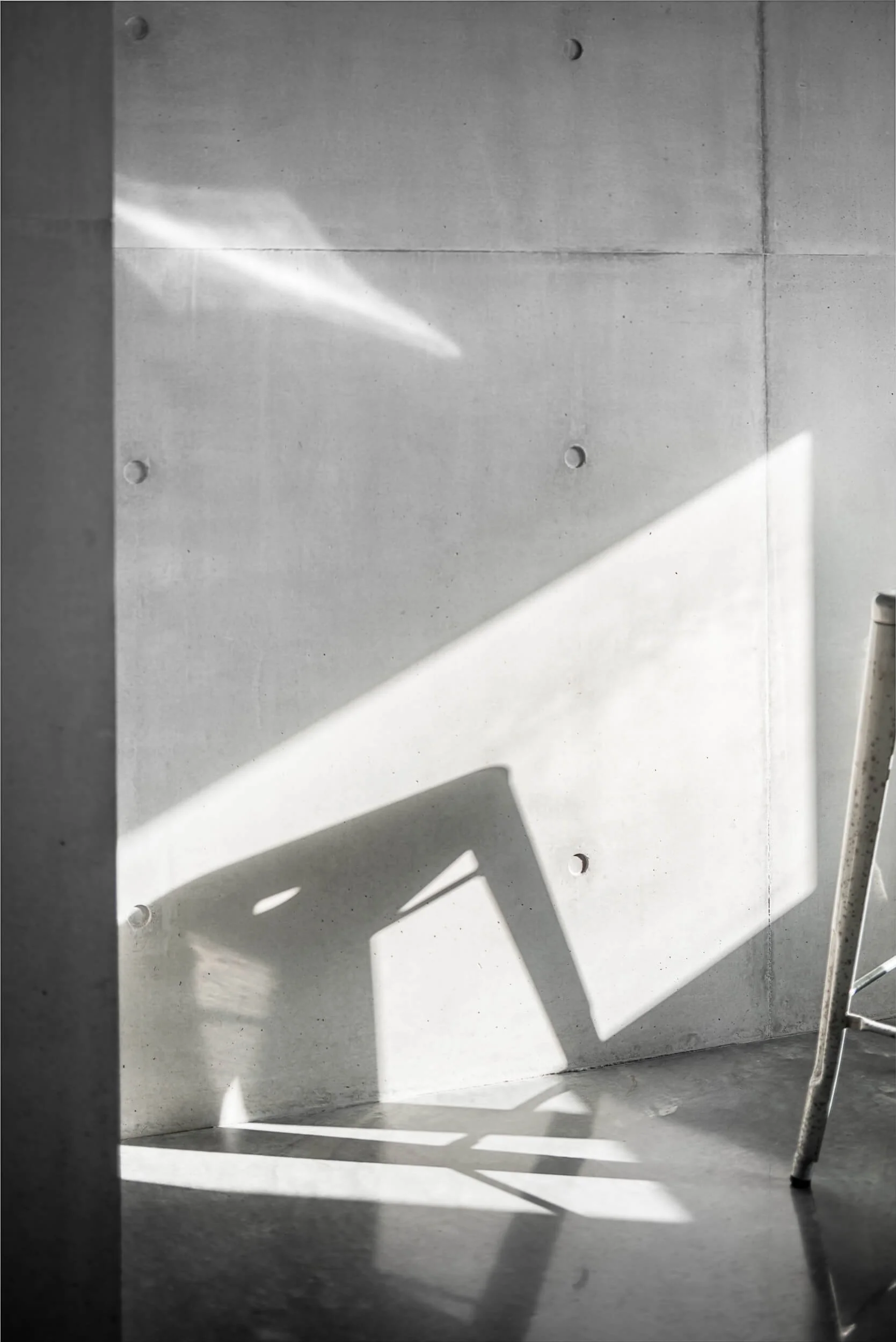 Premium architectural photography and film documenting true materiality and craftsmanship—highlighting raw off-form concrete and geometric light play—for Master Builders and designers in Regional NSW.