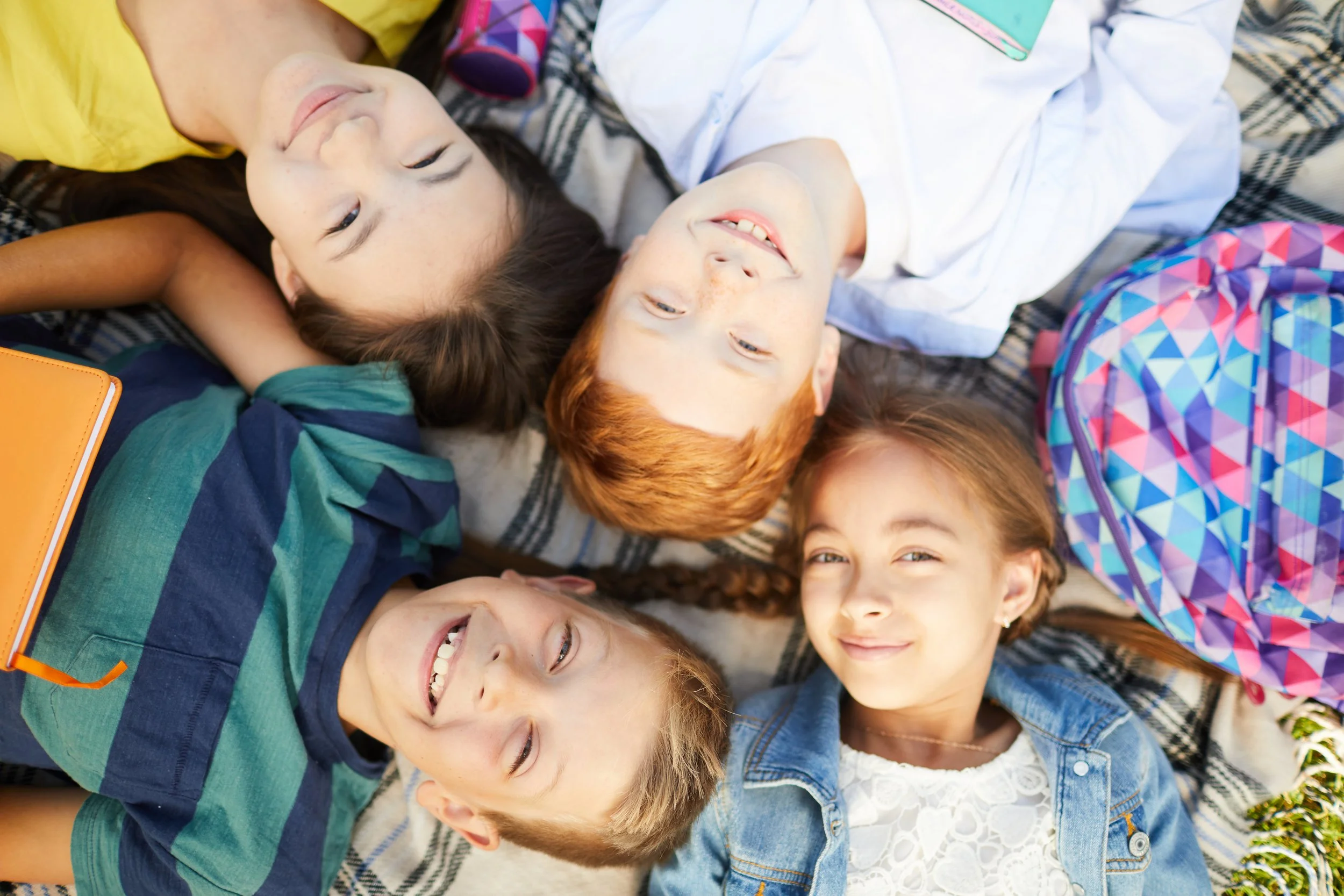 Children smiling in a circle