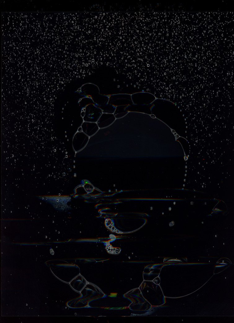 A dark, abstract image resembling a duck drinking from a cup, with bubbles and water droplets surrounding it. Created with scanography