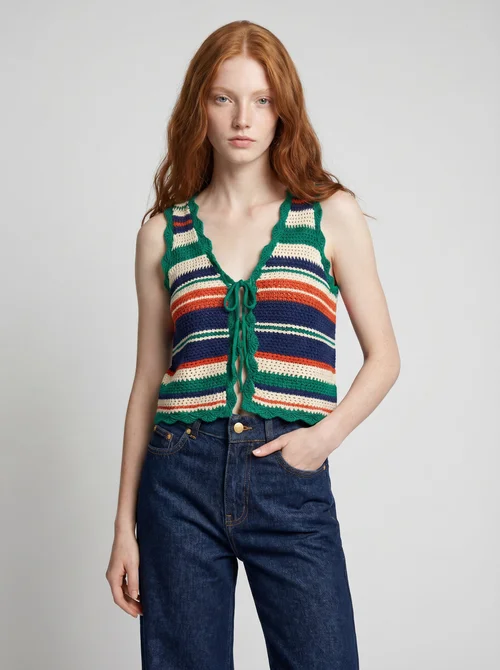 ORB AI packshot of the model with hand in pocket, striped vest and wide-leg jeans