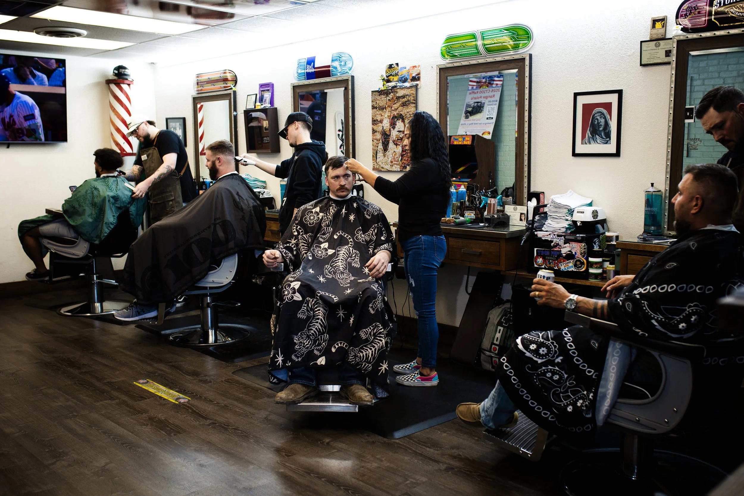 Customers relaxing at Stone and Razor Barbershop in Burleson, Texas