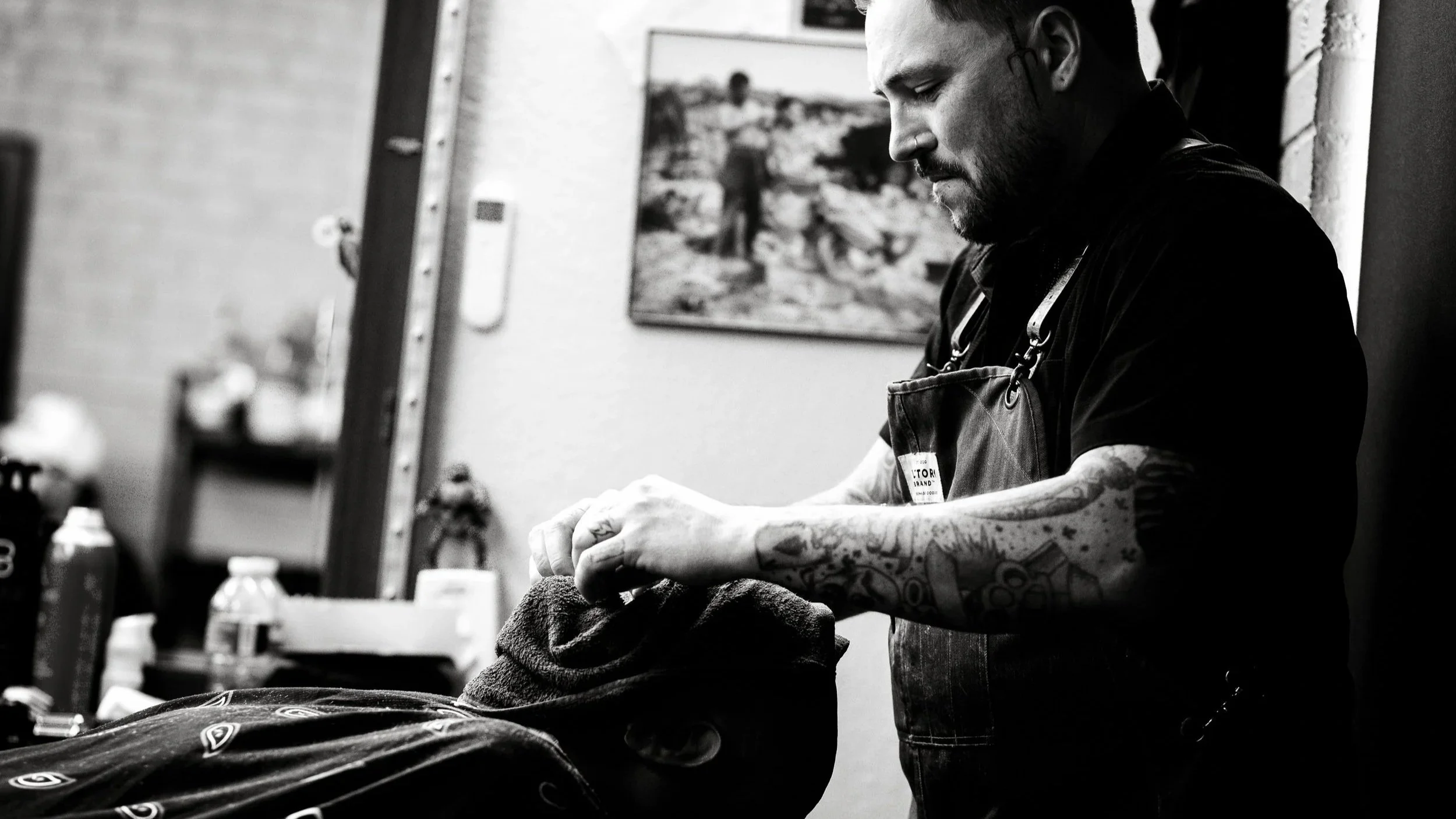 Brian doing a hot towel treatment at Stone and Razor in Burleson, Texas