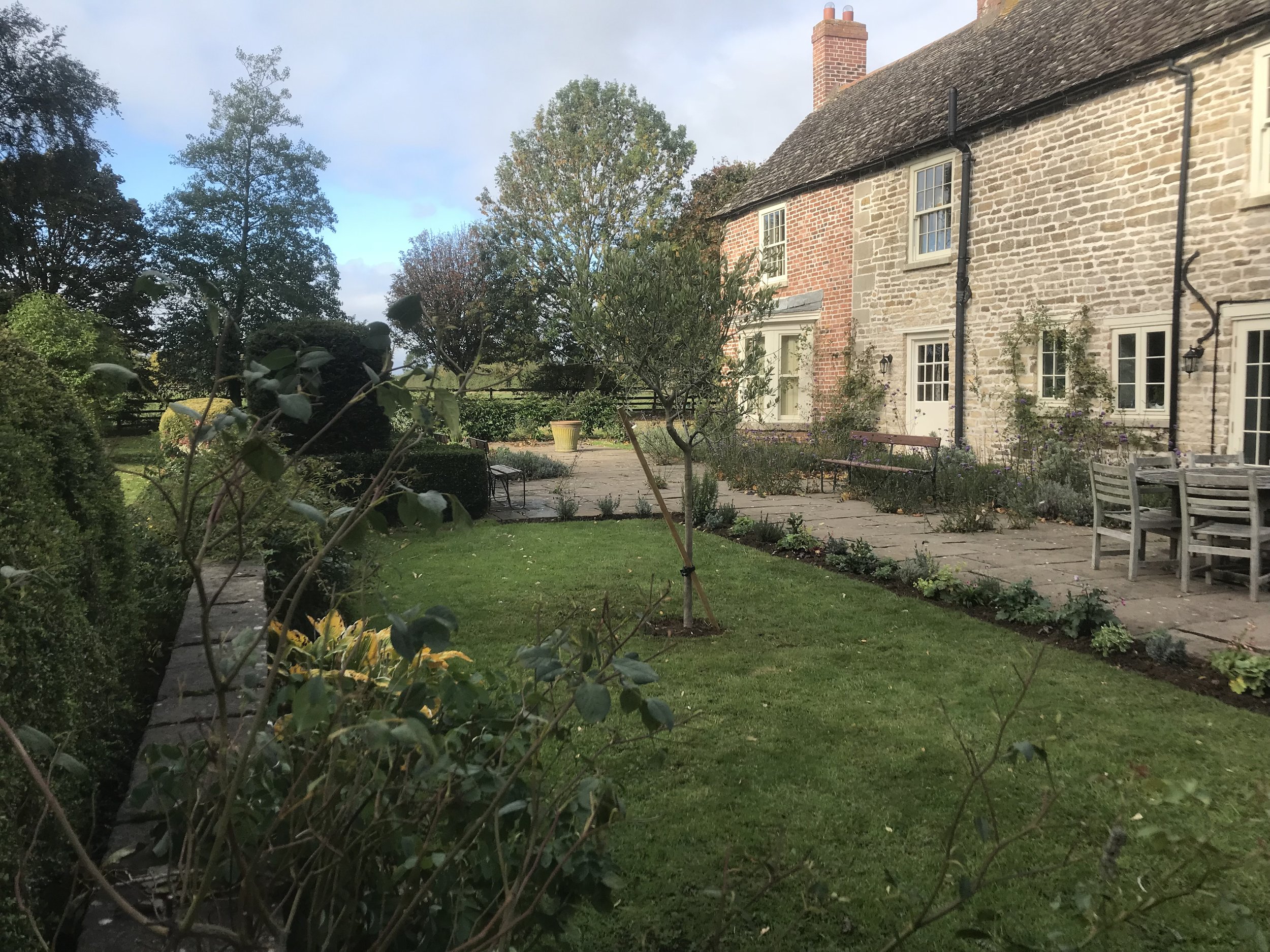 Terrace gardens moving from formality of house to surrounding landscape. Burley. Rutland