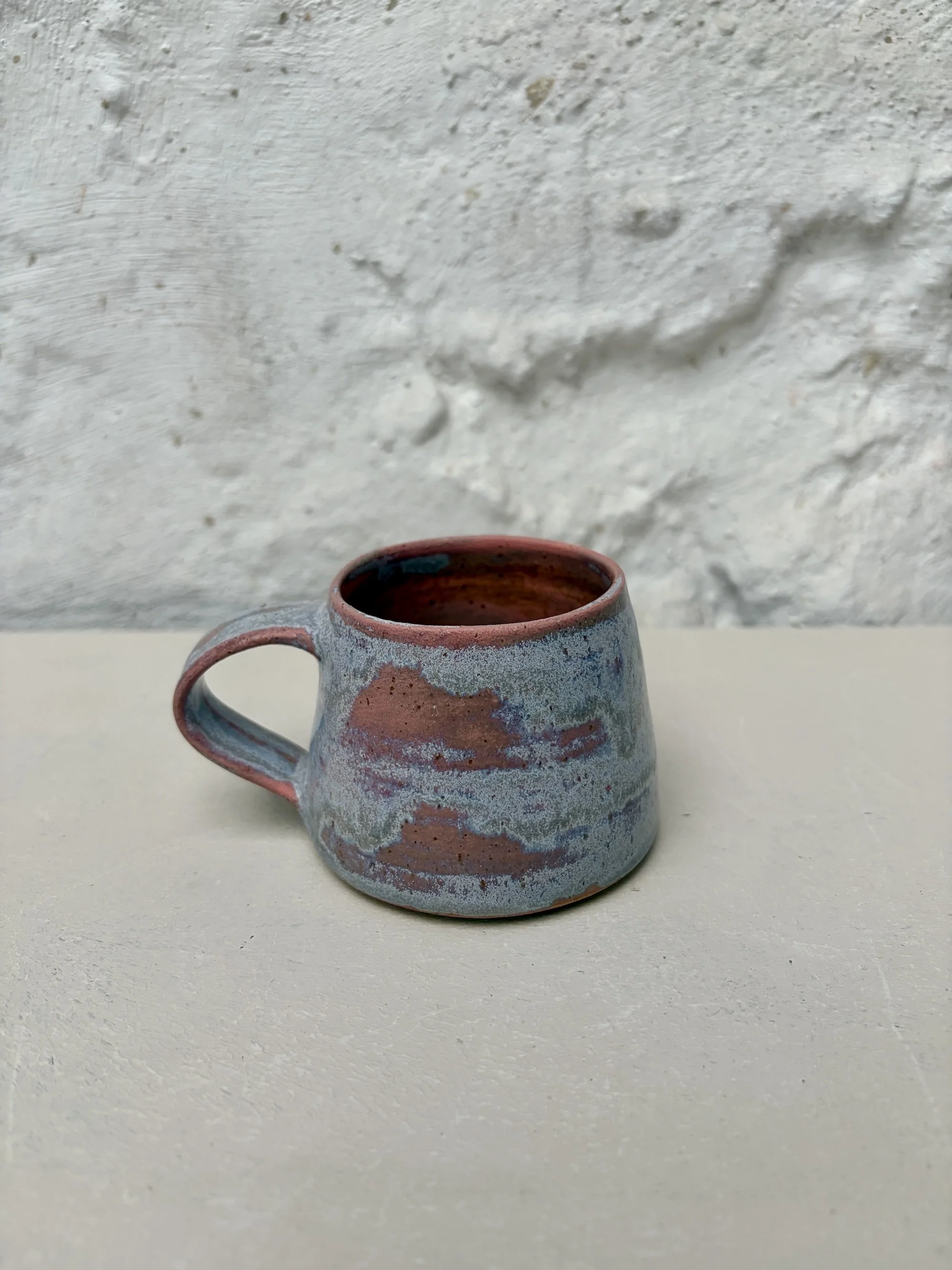 Small cup in pink sky glaze