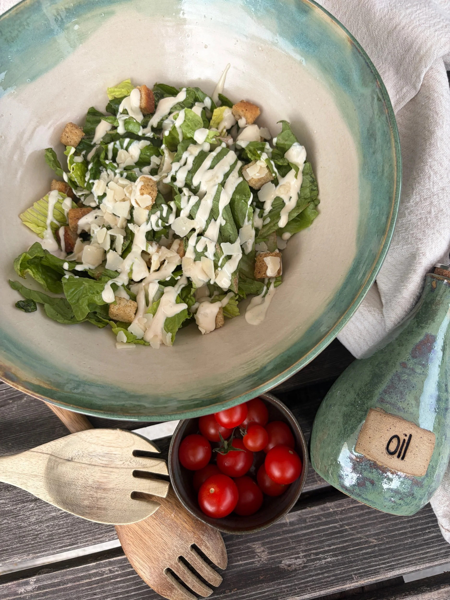 Large V shaped bowl in pistachio glaze with salad