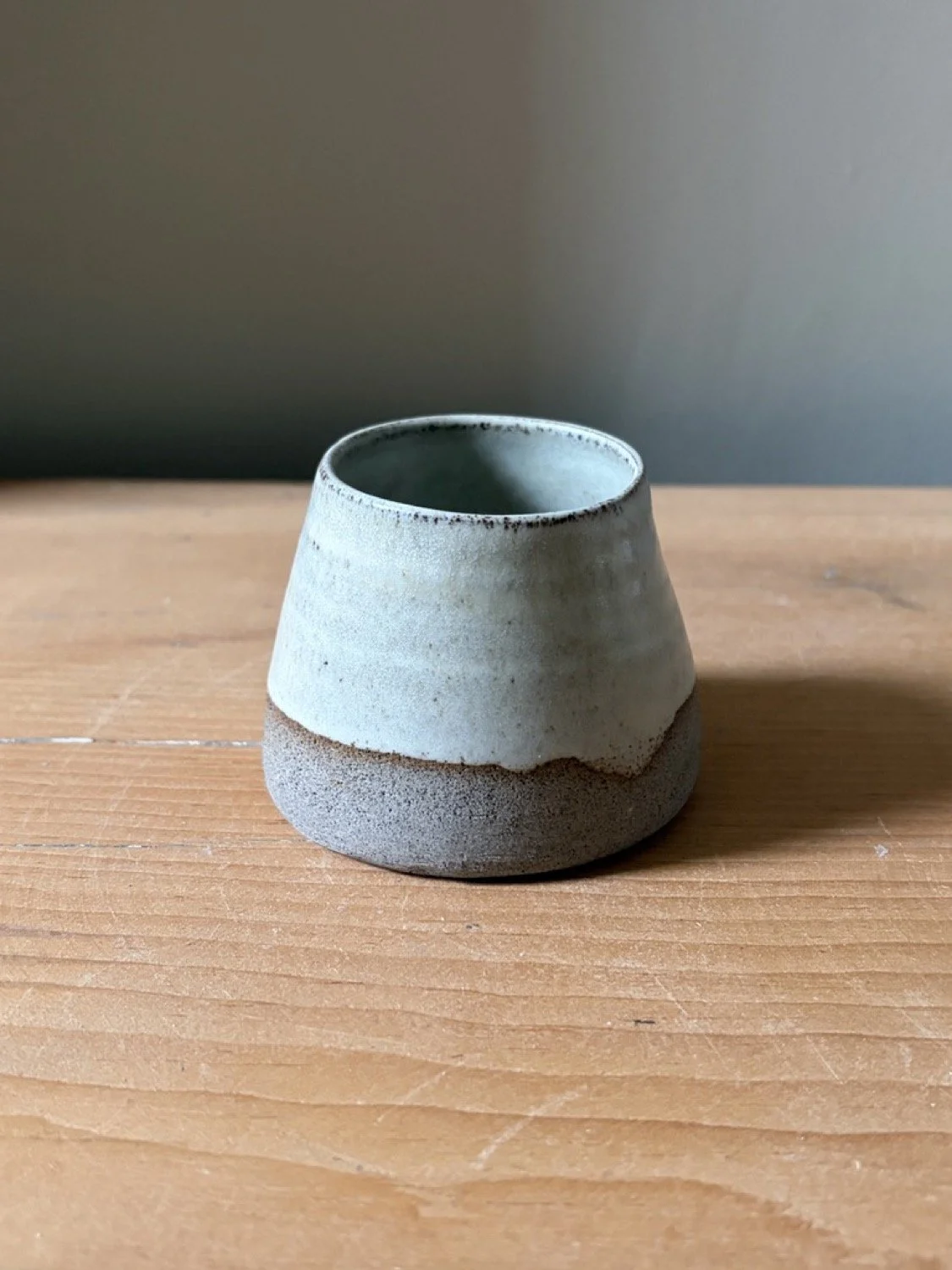 Handmade wheel thrown stoneware handleless cup grey clay vanilla glaze