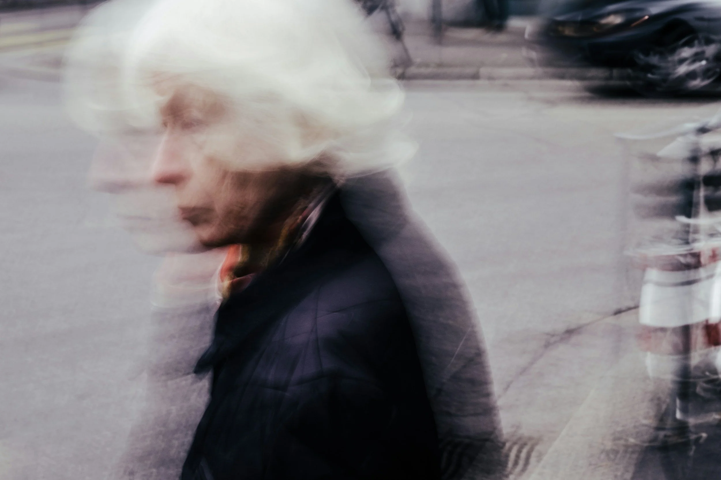 Image of an old lady walking in confusion