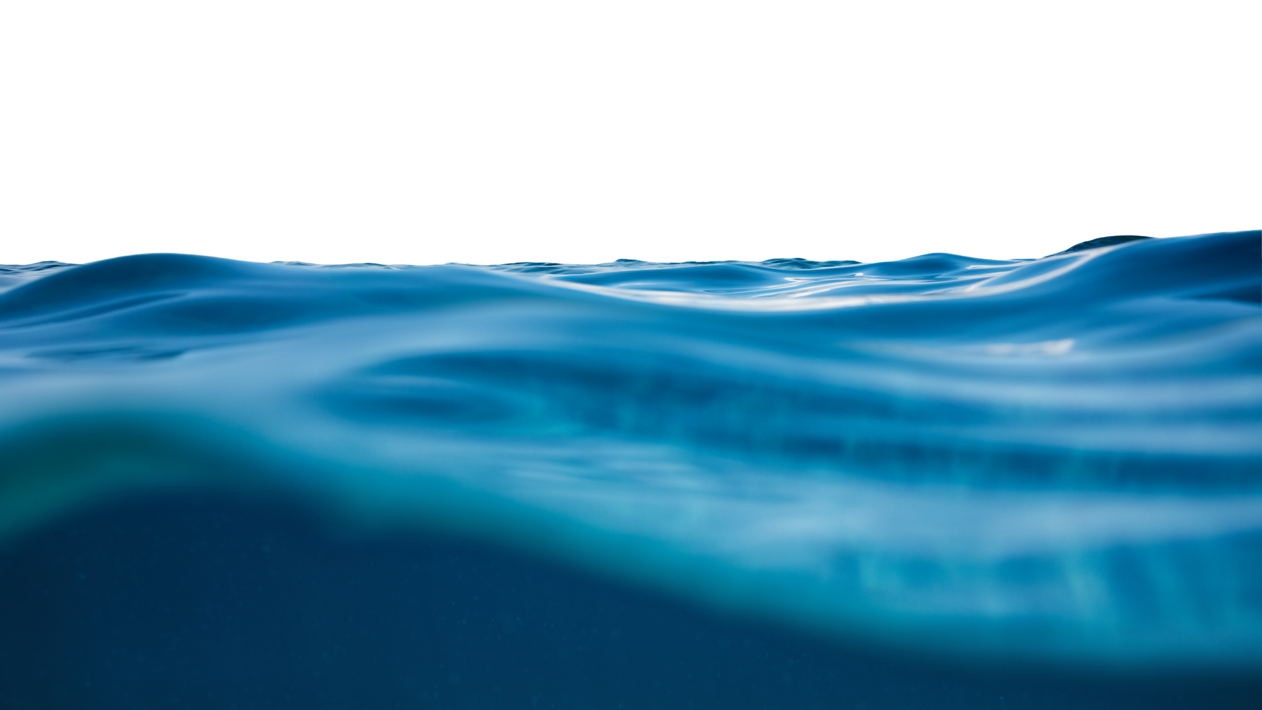 Close-up of calm ocean waves with a clear blue appearance, taken from a low angle.