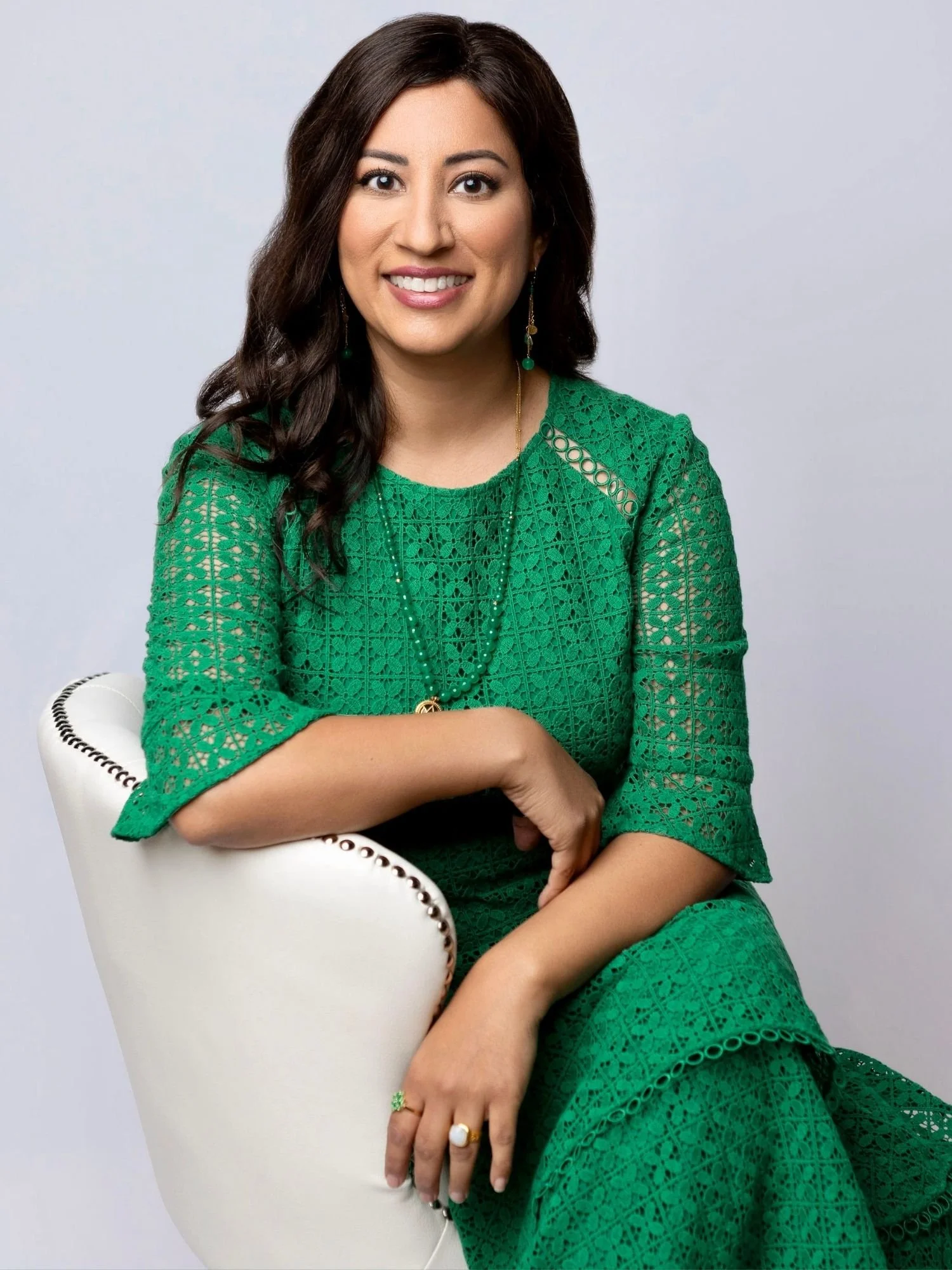 Dr. Monisha Bhanote in white chair