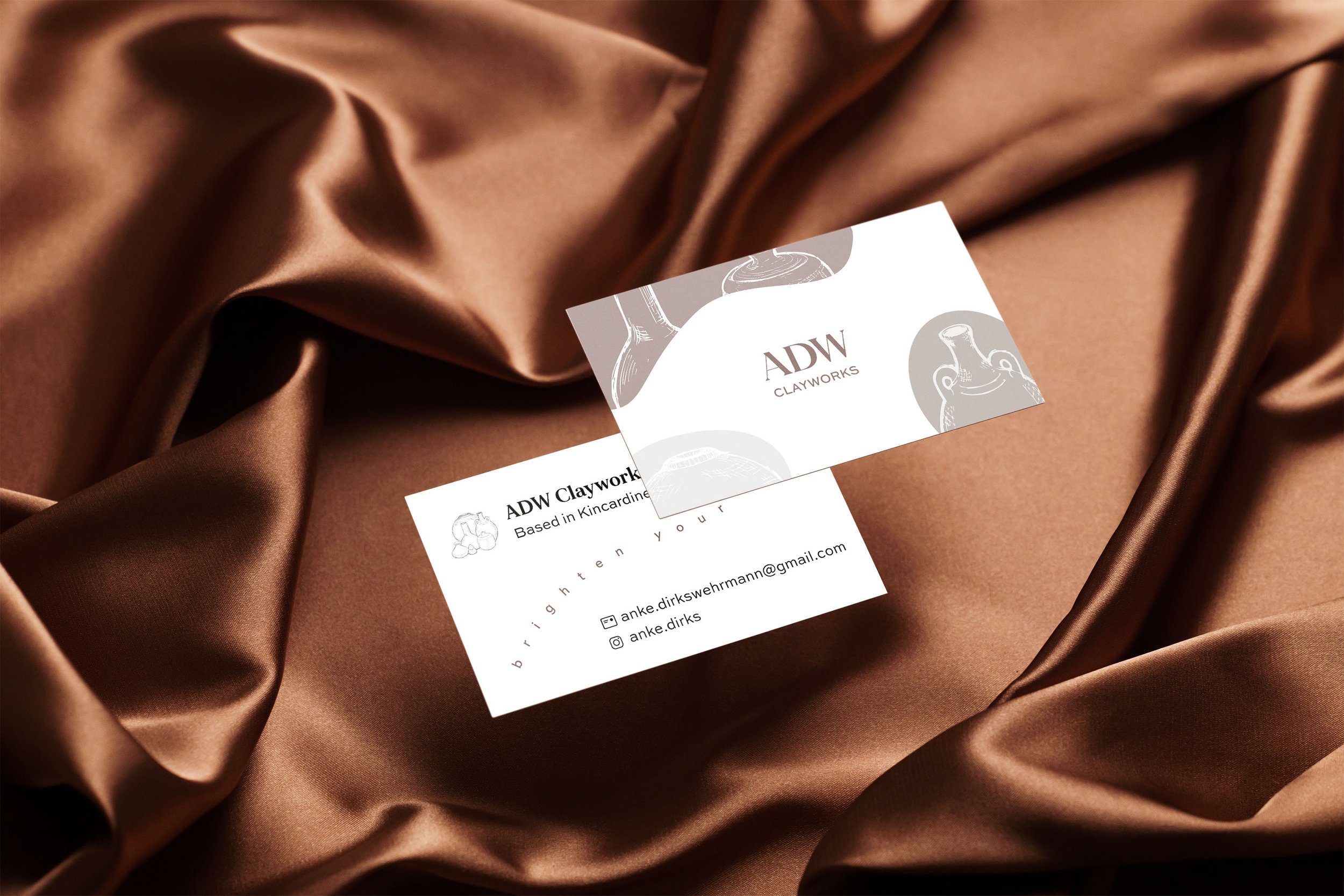 Two_Business_Cards_On_Satin_Background.jpg