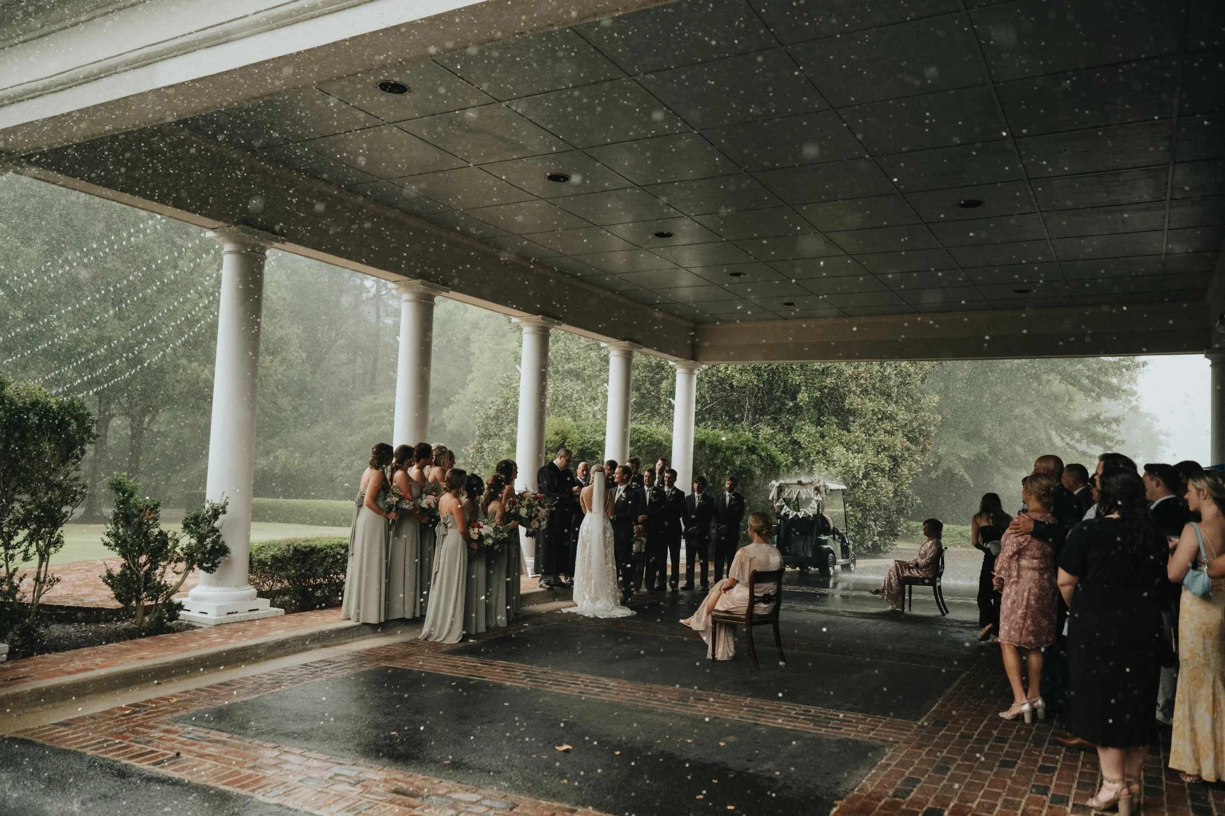 outdoor wedding ceremony in the rain