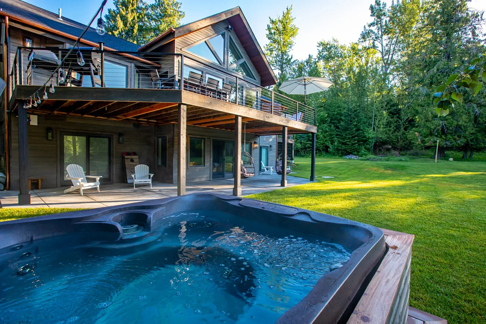 Hot tub and outdoor living area at Back Forty Lodge
