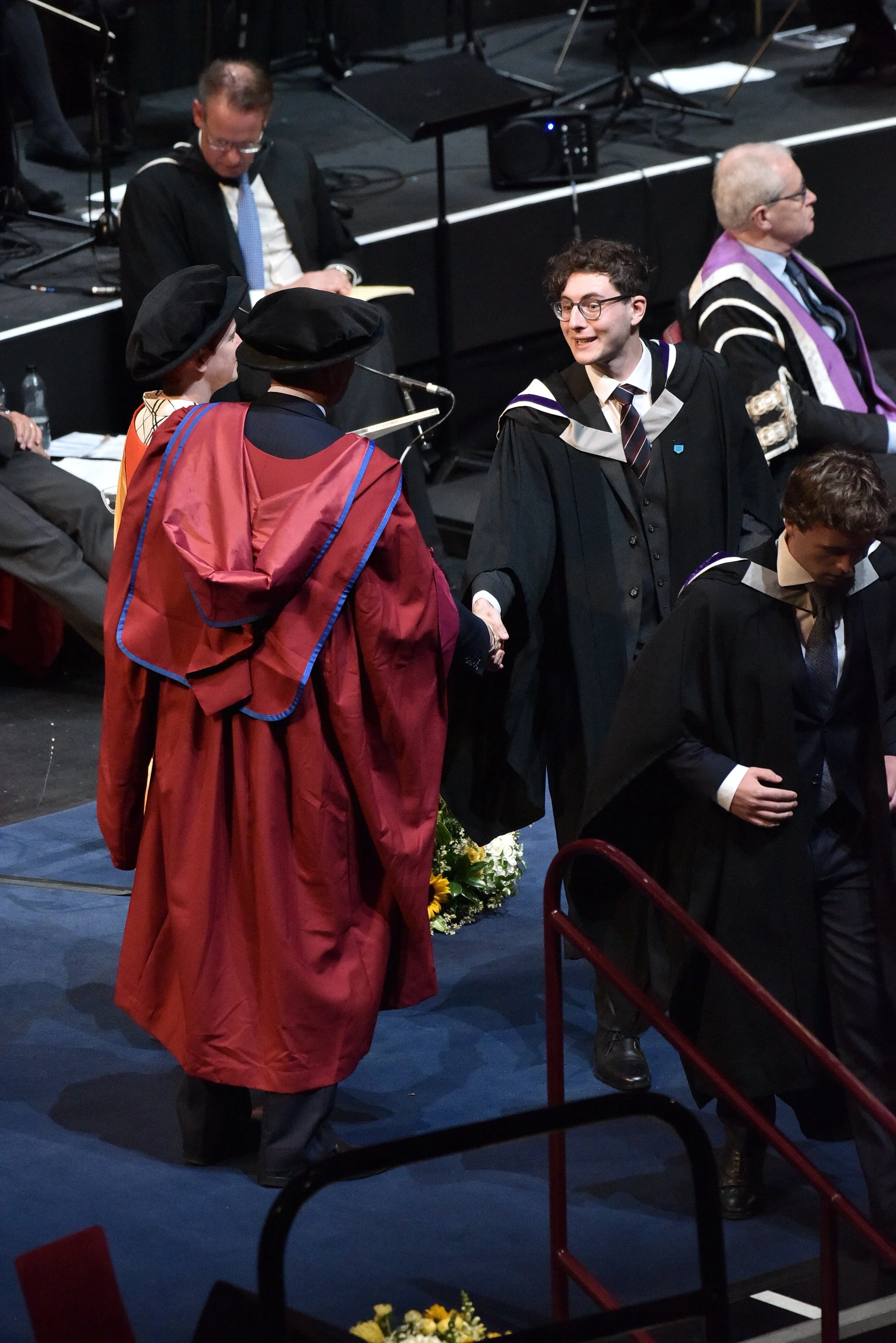 Crossing the stage of The Royal Albert Hall upon graduating from imperial College London