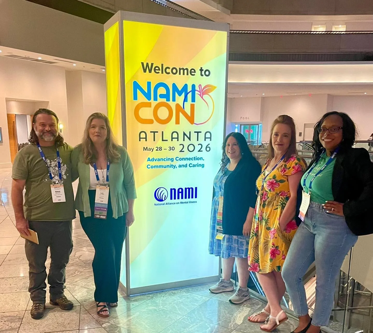 Lori Smith, Shelly Black, and Tia Lewis representing NAMI at NAMIcon 2026&mdash;strengthening connections and sharing hope.