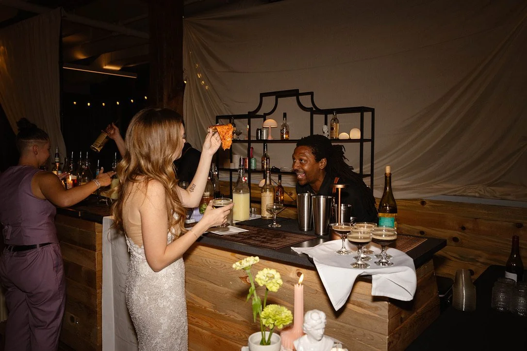 Guest and bartender at wedding reception