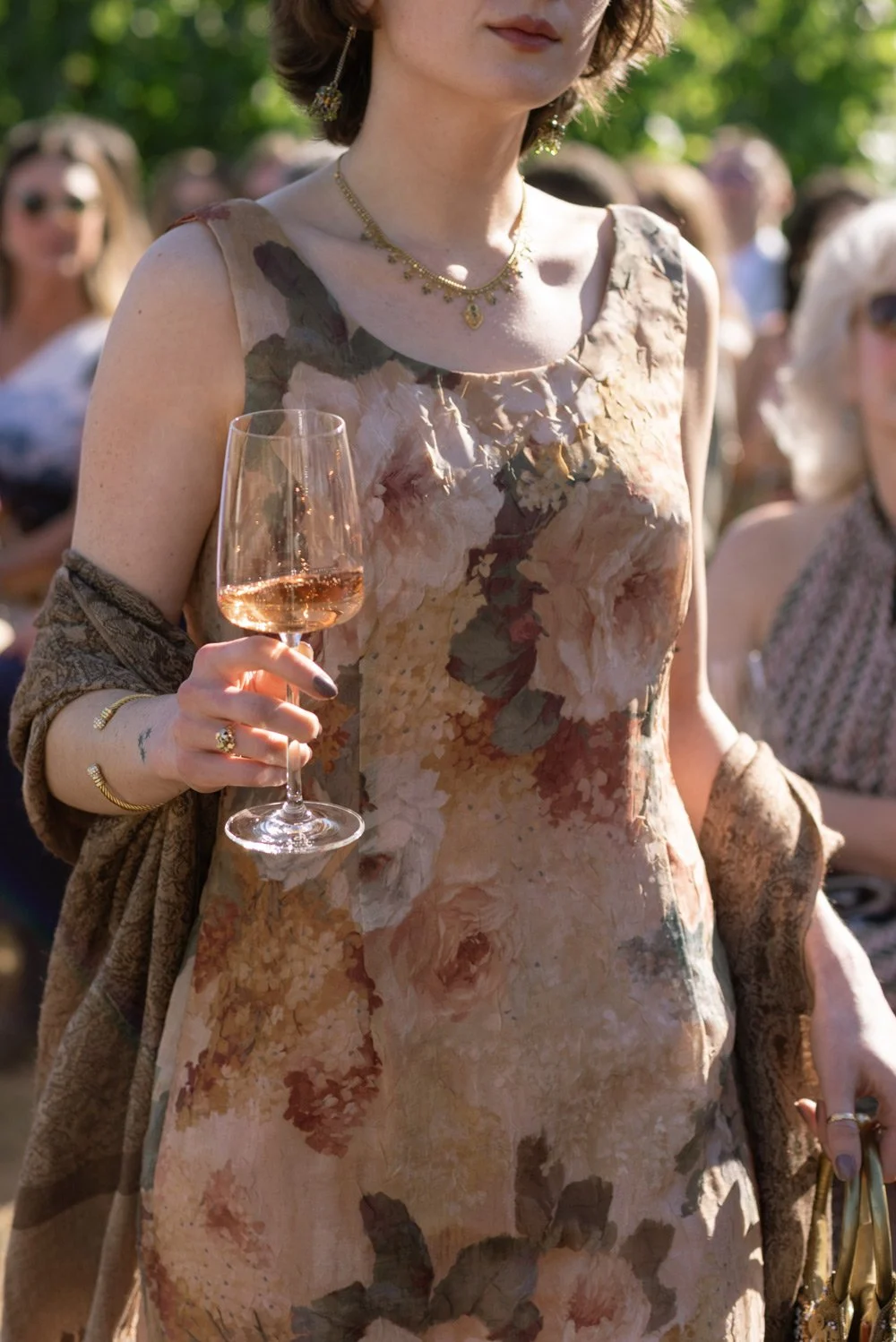 Woman with rosé wine at wedding reception