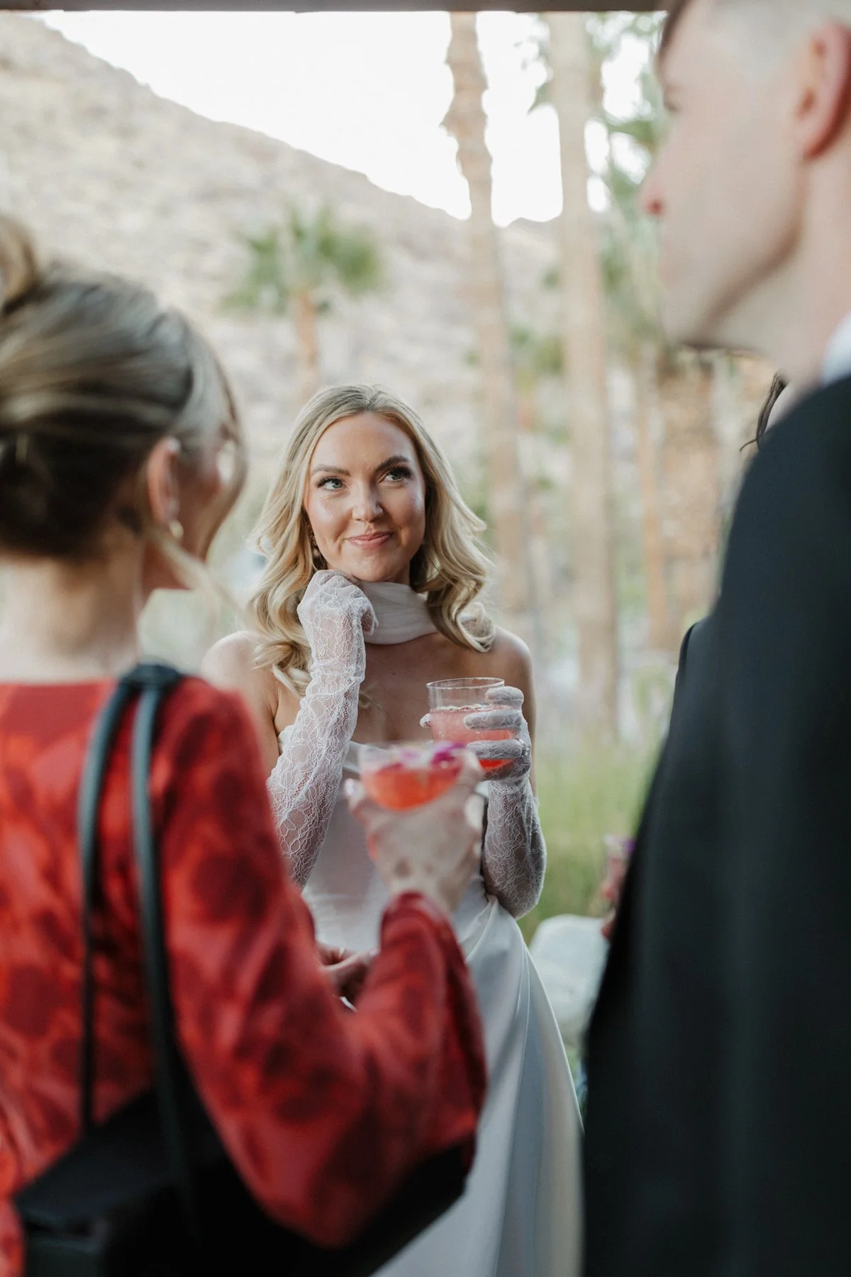 Bride sipping a cocktail at a Palm Springs wedding with private event bartending